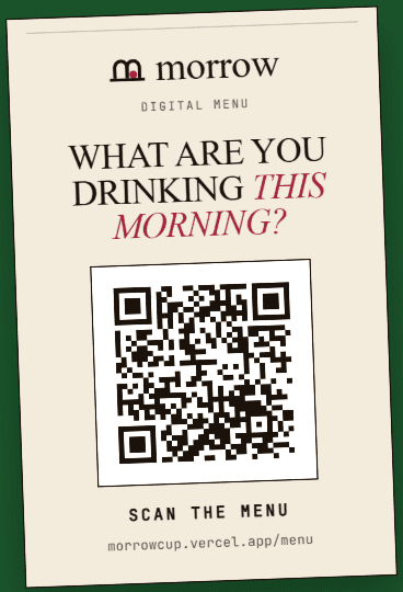 Sample printed café table card with a QR code that reads Scan the menu